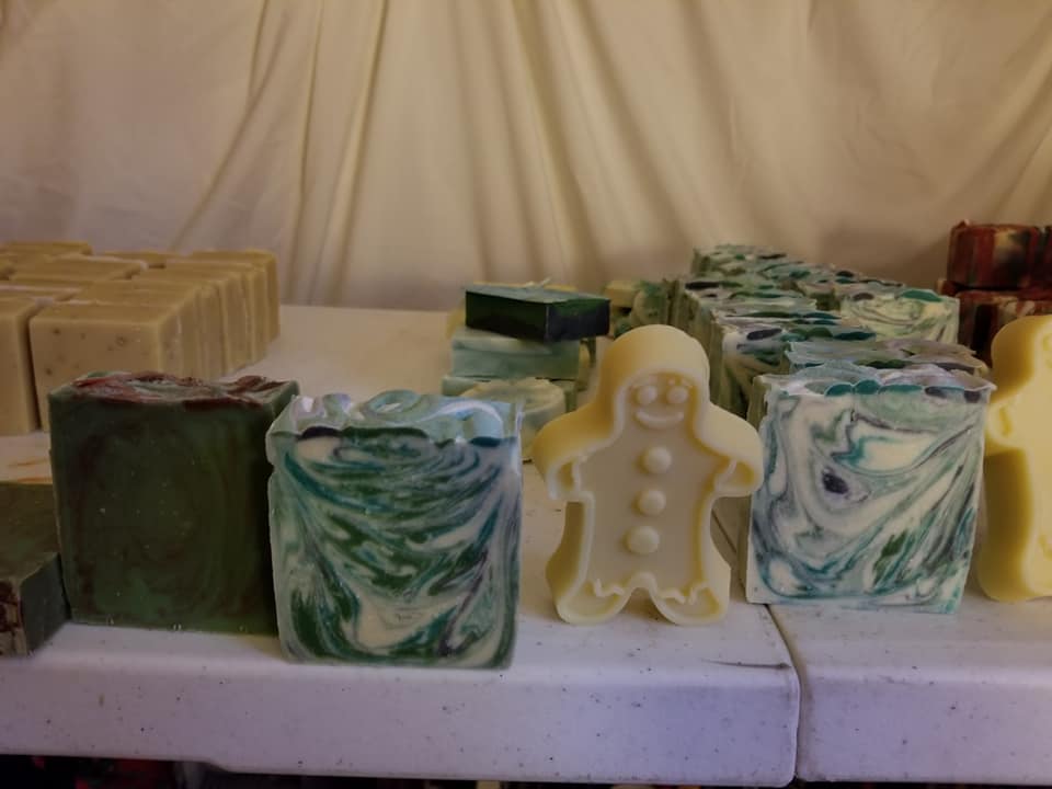 different homemade soaps arranged on a table