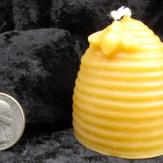 honeybee on a hive beeswax candle